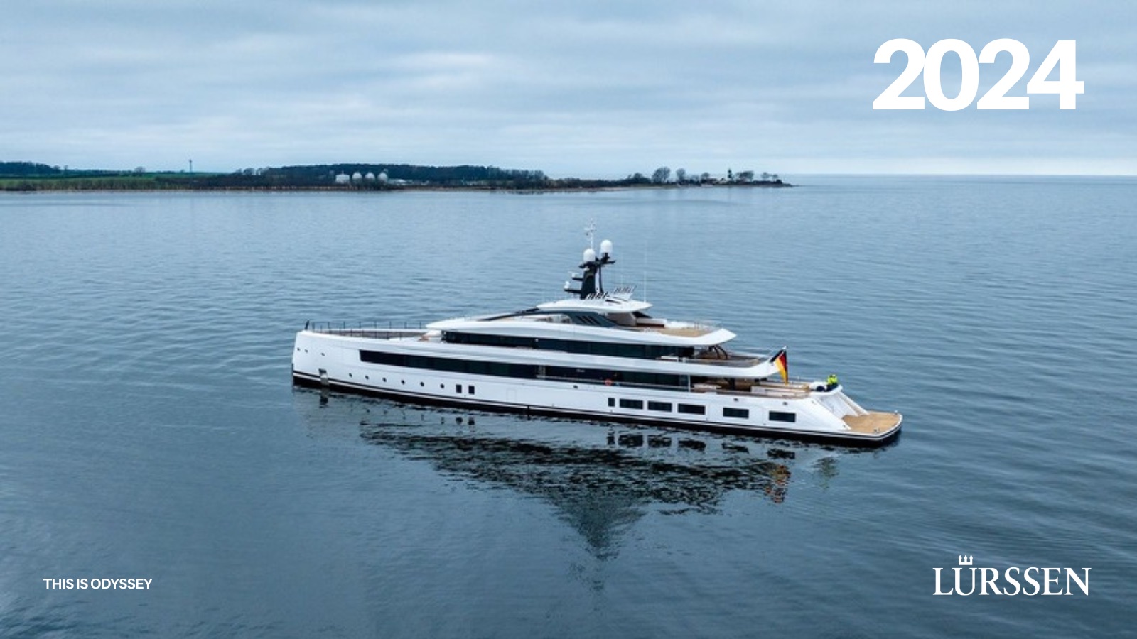Cover of the 2024 Lürssen annual report by This is Odyssey, a yacht at anchor under a grey sky